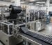 Automated machine for producing garbage bags in a modern factory setting