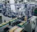 Modern transparent packaging machine producing cellophane bags in a factory setting